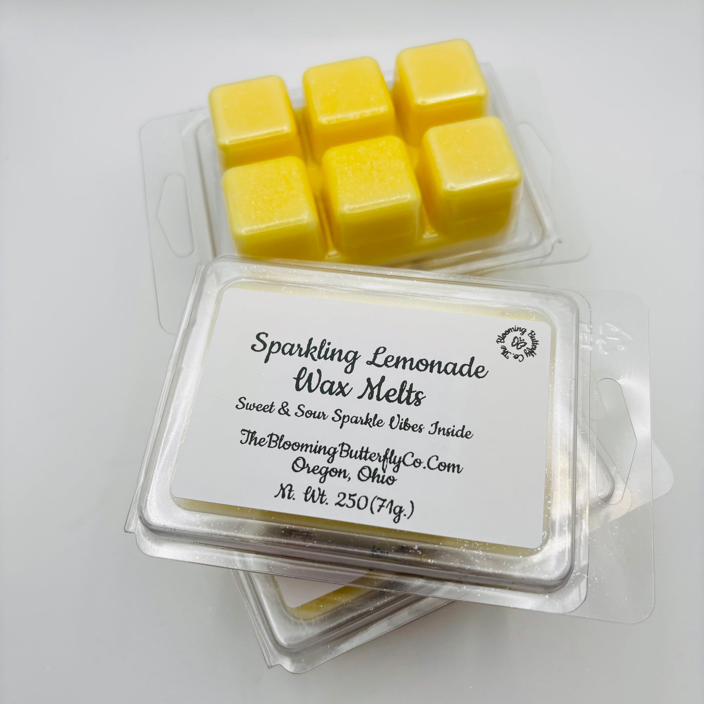 bold smelling sparkling lemonade wax melts with label packed in a clamshell made by the blooming butterfly company