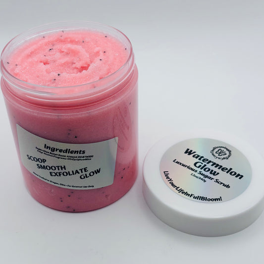 Pink watermelon glow sugar scrub jar with a holographic label on a white background handcrafted by the blooming butterfly company