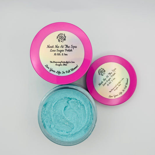 meet me at the spa sugar scrub in clear jar with barbie pink lid colored with sea glass mica and sparkles handcrafted by the blooming butterfly company