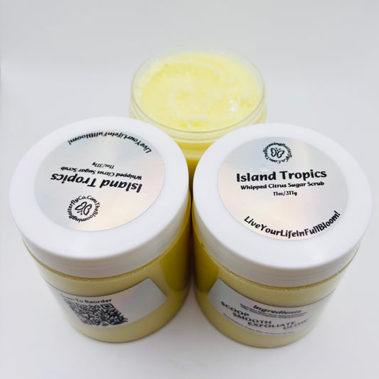 Three jars of Island Tropics whipped citrus sugar scrub on a white background with holographic label hand crafted by the blooming butterfly company

