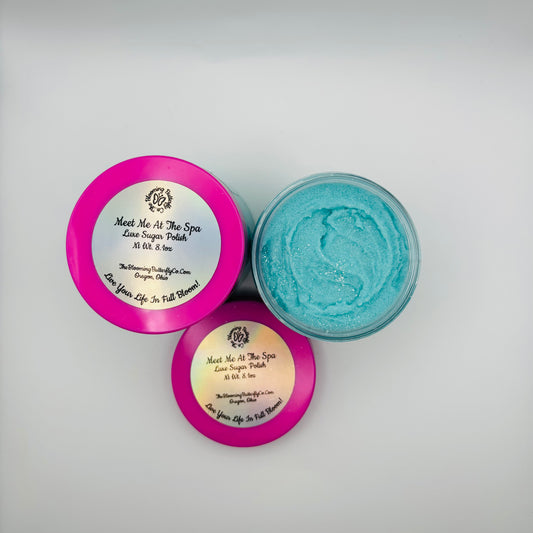 meet me at the spa sugar scrub in clear jar with barbie pink lid colored with sea glass mica and sparkles handcrafted by the blooming butterfly company