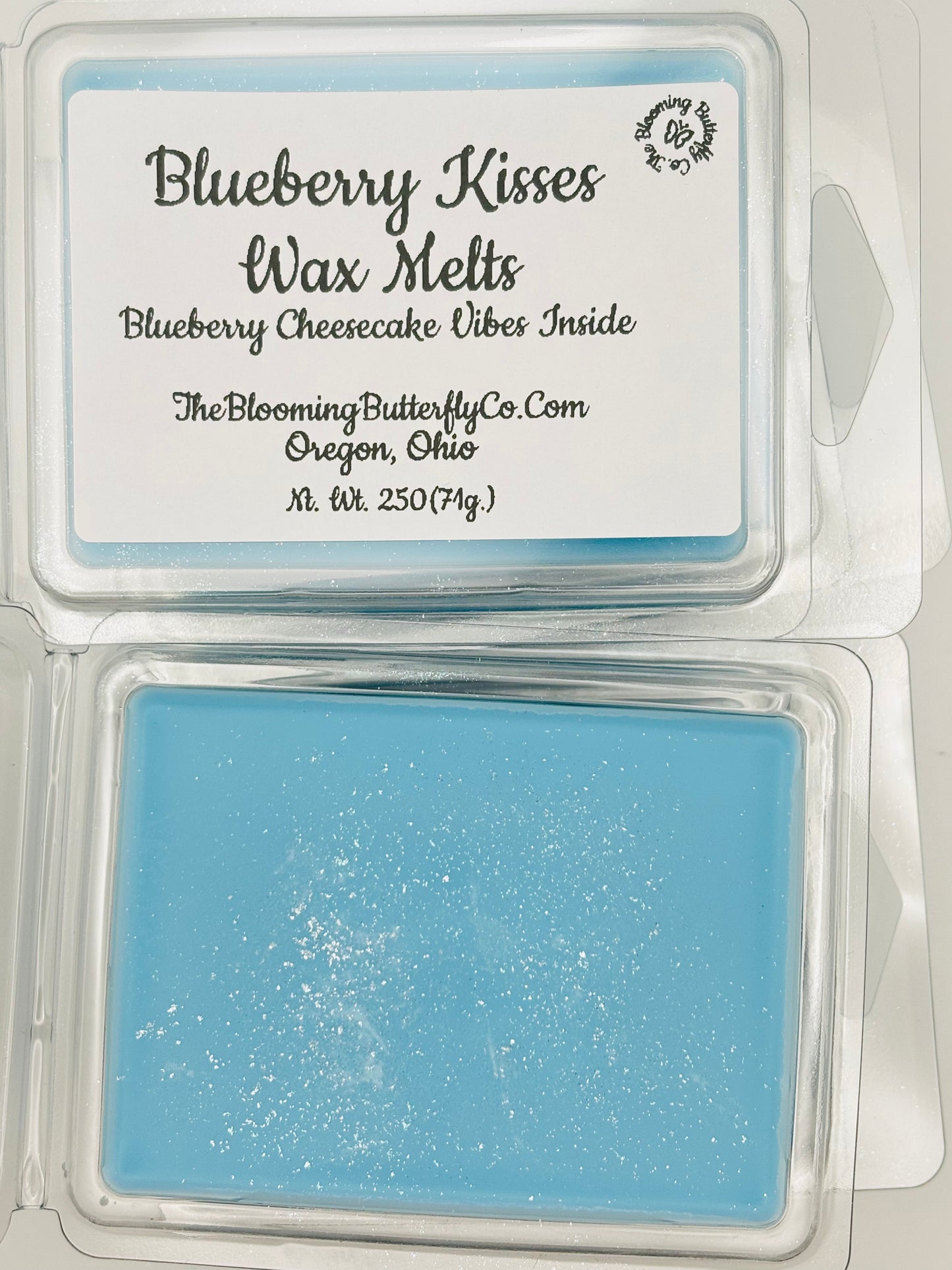 Blueberry kisses, scented in blueberry cheesecake wax melts colored blue with shimmering Mica, handcrafted by the blooming butterfly company