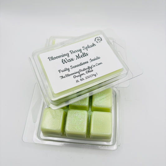 Pack of Blooming Berry Splash wax melts with a white label on a light gray background handcrafted by the blooming butterfly Company