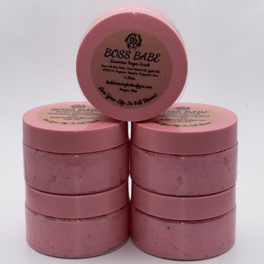 boss babe cotton candy and birthday cake sugar scrub with shimmering pink and poppyseeds in container with pink lid by the blooming butterfly company