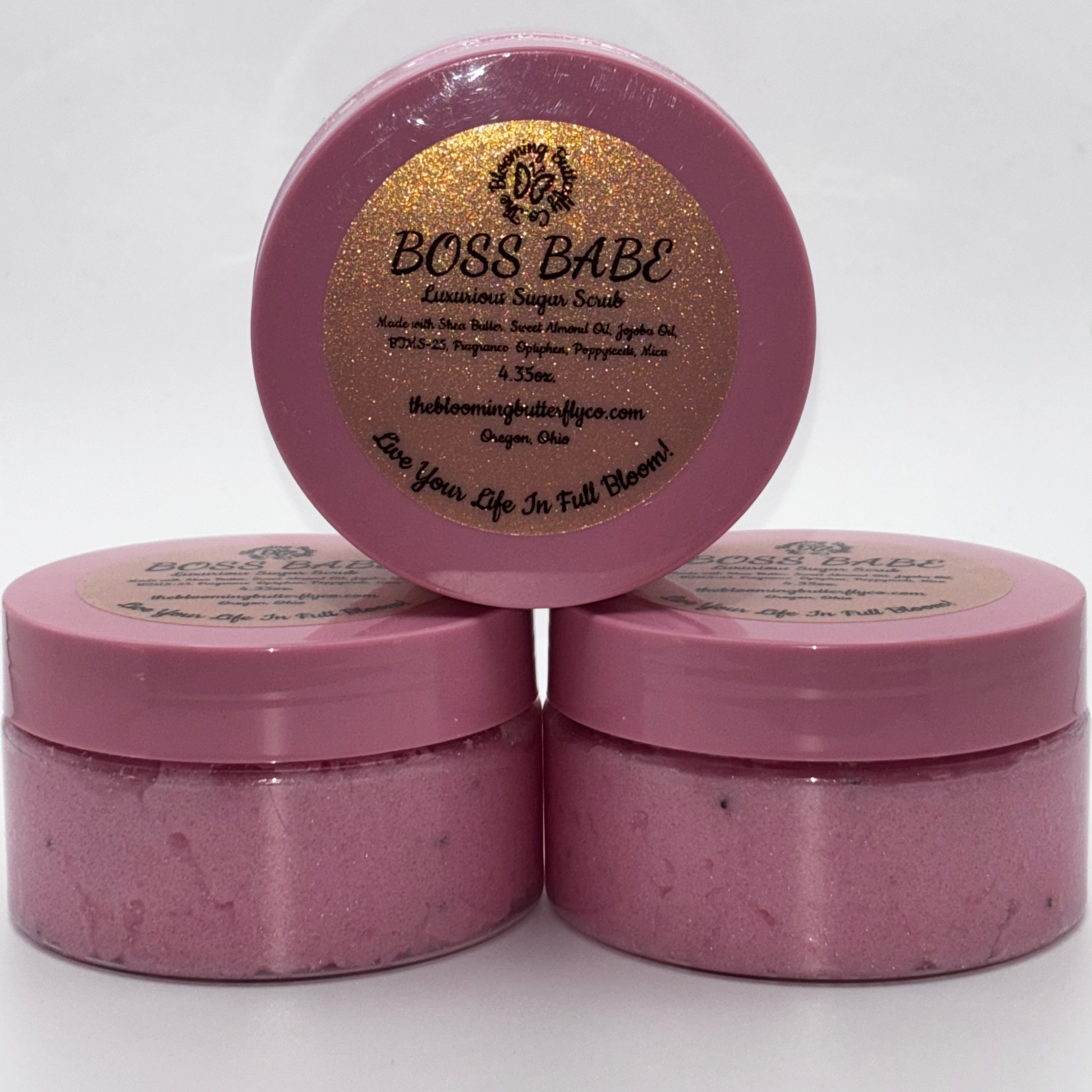 boss babe cotton candy and birthday cake sugar scrub with shimmering pink and poppyseeds in container with pink lid by the blooming butterfly company