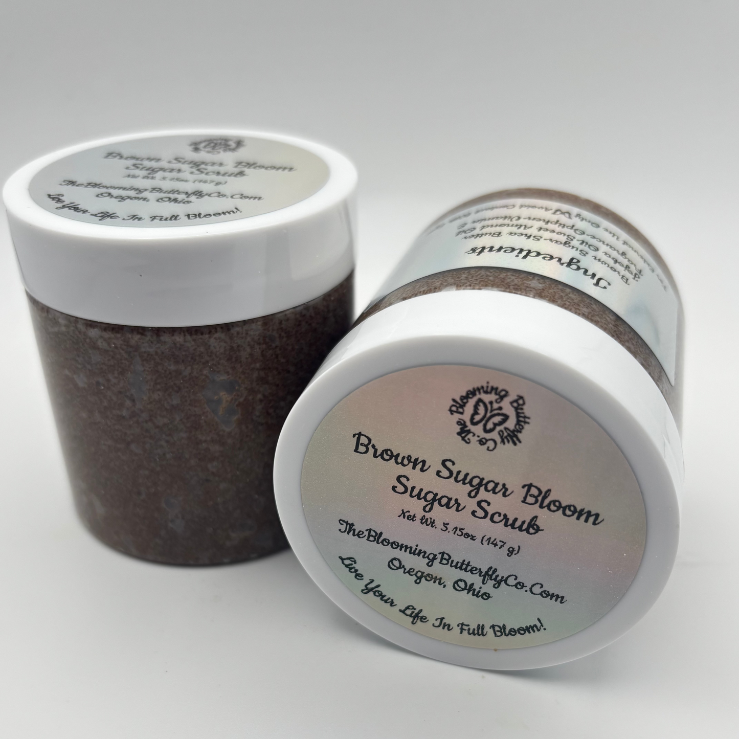 Brown Sugar Bloom Sugar Scrub with white lid on a white background handcrafted by the blooming butterfly company
