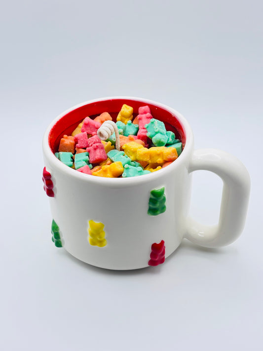 yummy gummy soy wax candle in oversized yummy gummy mug with colorful embeds.