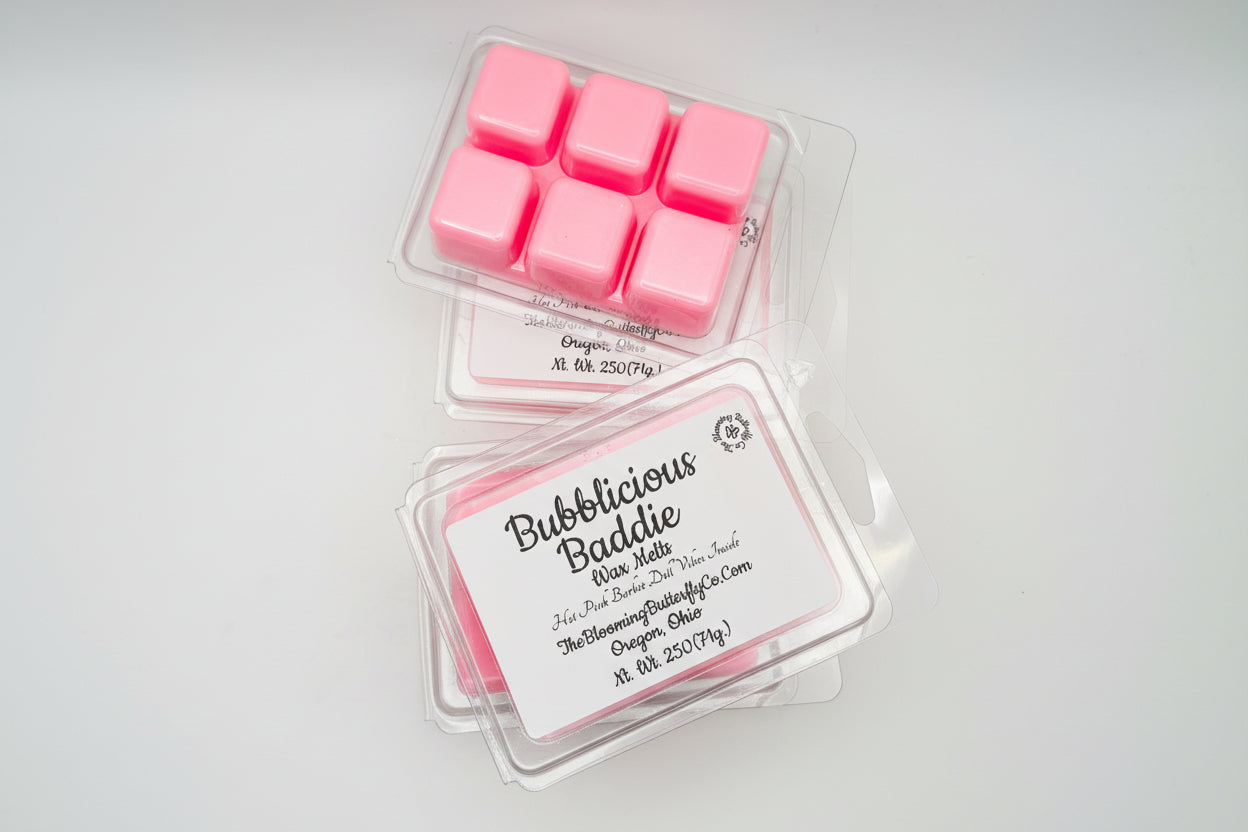 6 shimmering hot pink wax melts in square clam shells with label made by the blooming butterfly company