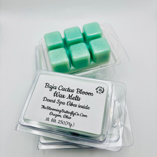 6 pack clamshells of baja cactus bloom wax melts with shimmering green sparkle and a label made by the blooming butterfly company