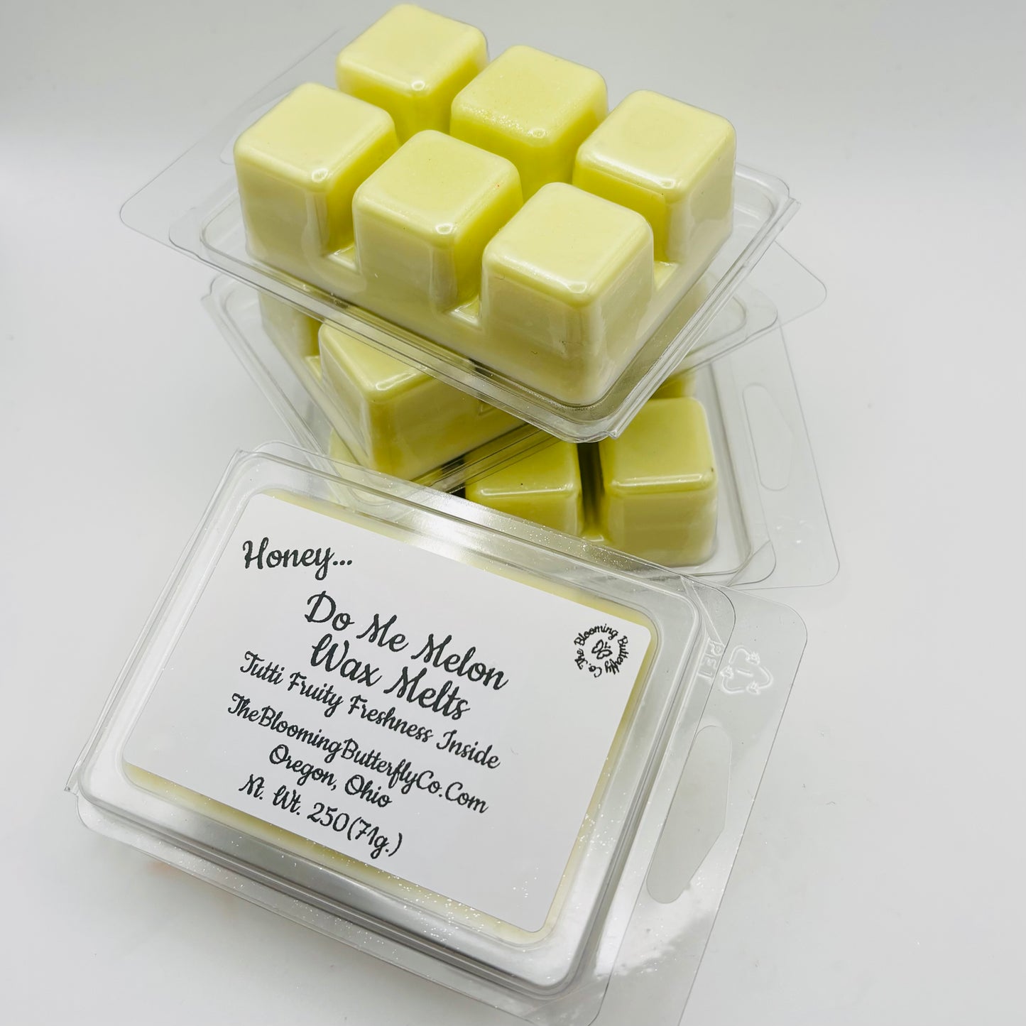 shimmering honey do me melon wax melts in a 6 count clamshell mold made by the blooming butterfly company
