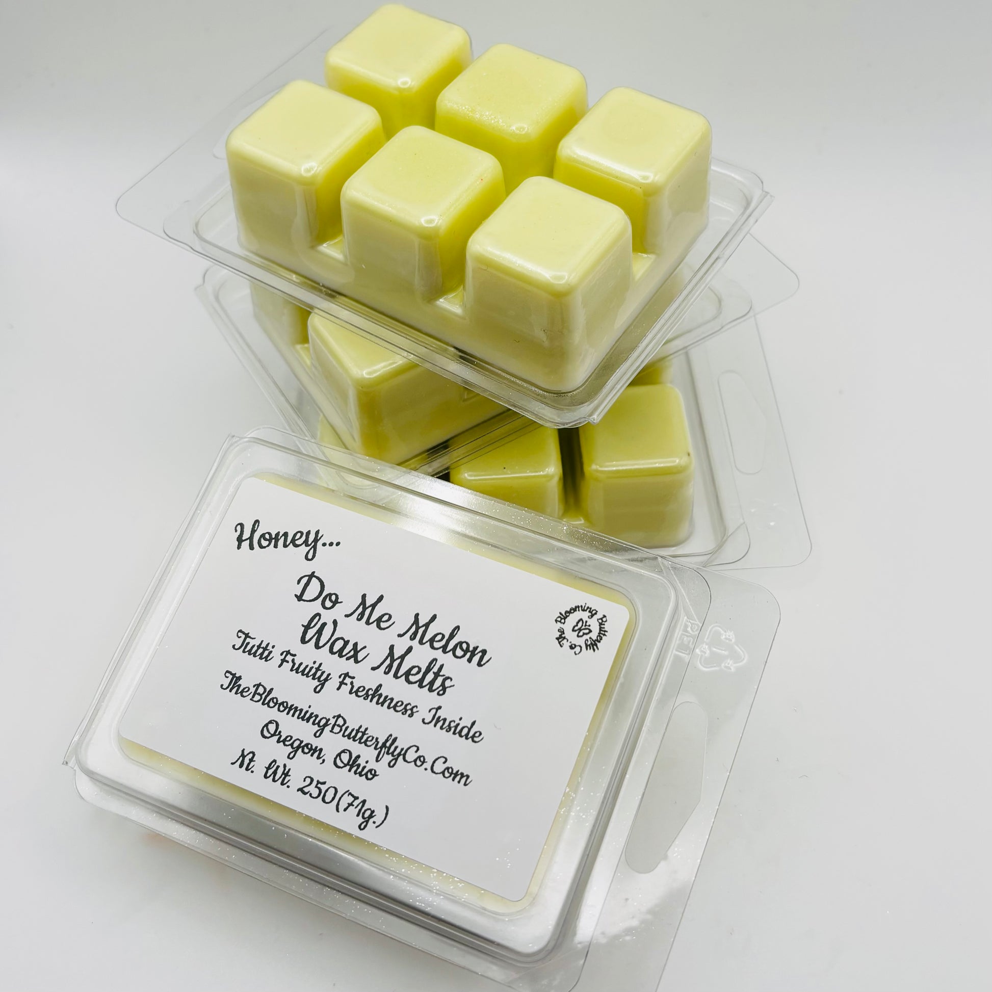 shimmering honey do me melon wax melts in a 6 count clamshell mold made by the blooming butterfly company