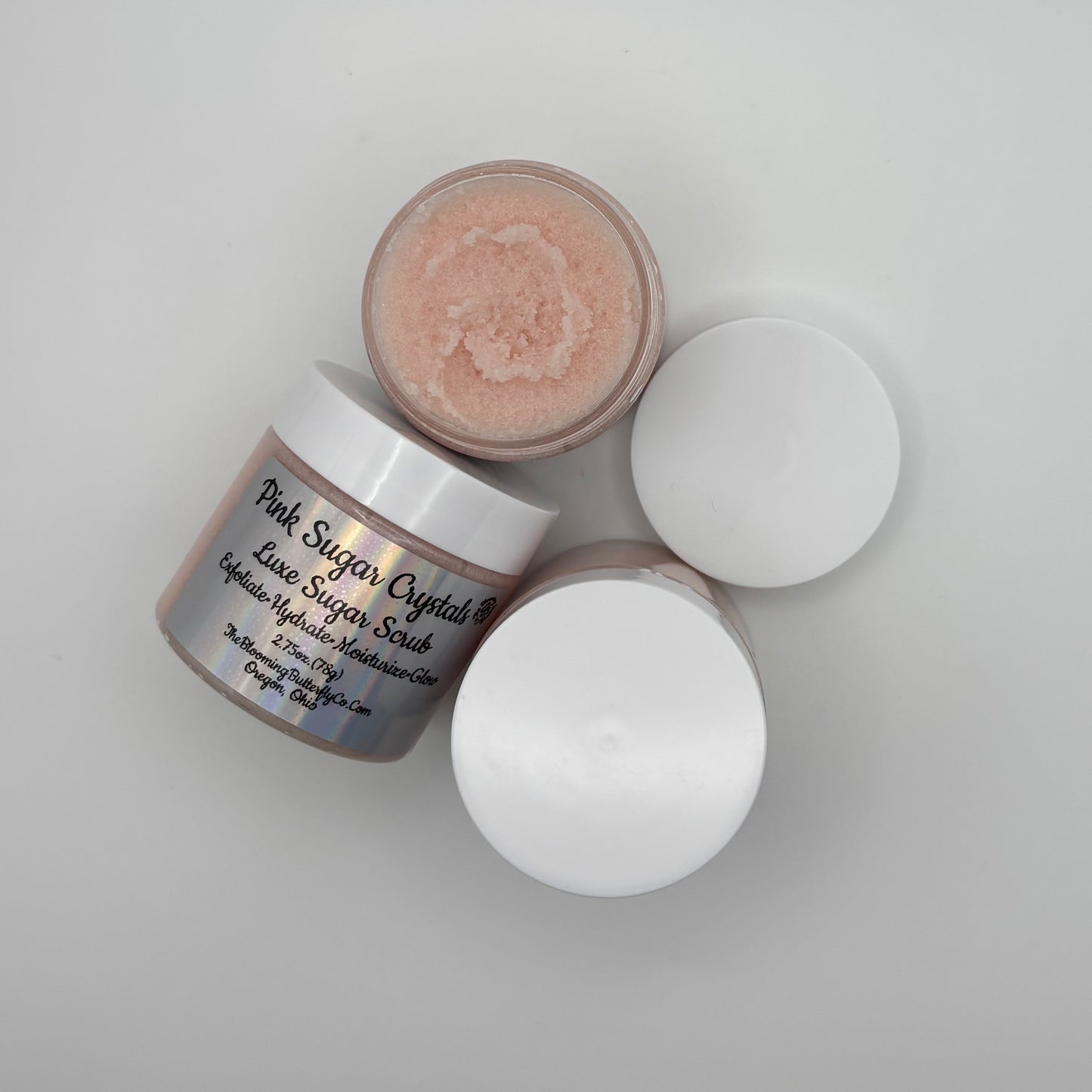 Two jars of Pink Sugar Crystals Luxe Sugar Scrub handcrafted by the blooming butterfly company