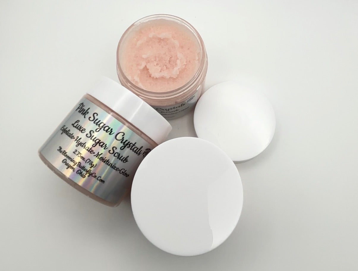 Two jars of Luxe Pink Sugar Crystal scrub on a white background handcrafted by the blooming butterfly company