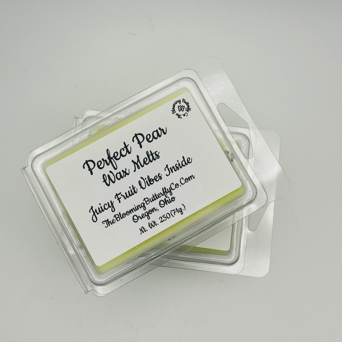 Perfect pair juicy fruit wax melts wax melts with a label on a gray background handcrafted by the blooming butterfly Company