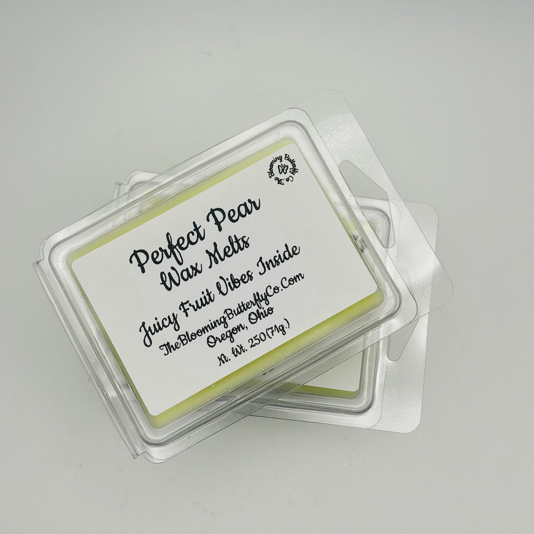 Perfect pair juicy fruit wax melts wax melts with a label on a gray background handcrafted by the blooming butterfly Company