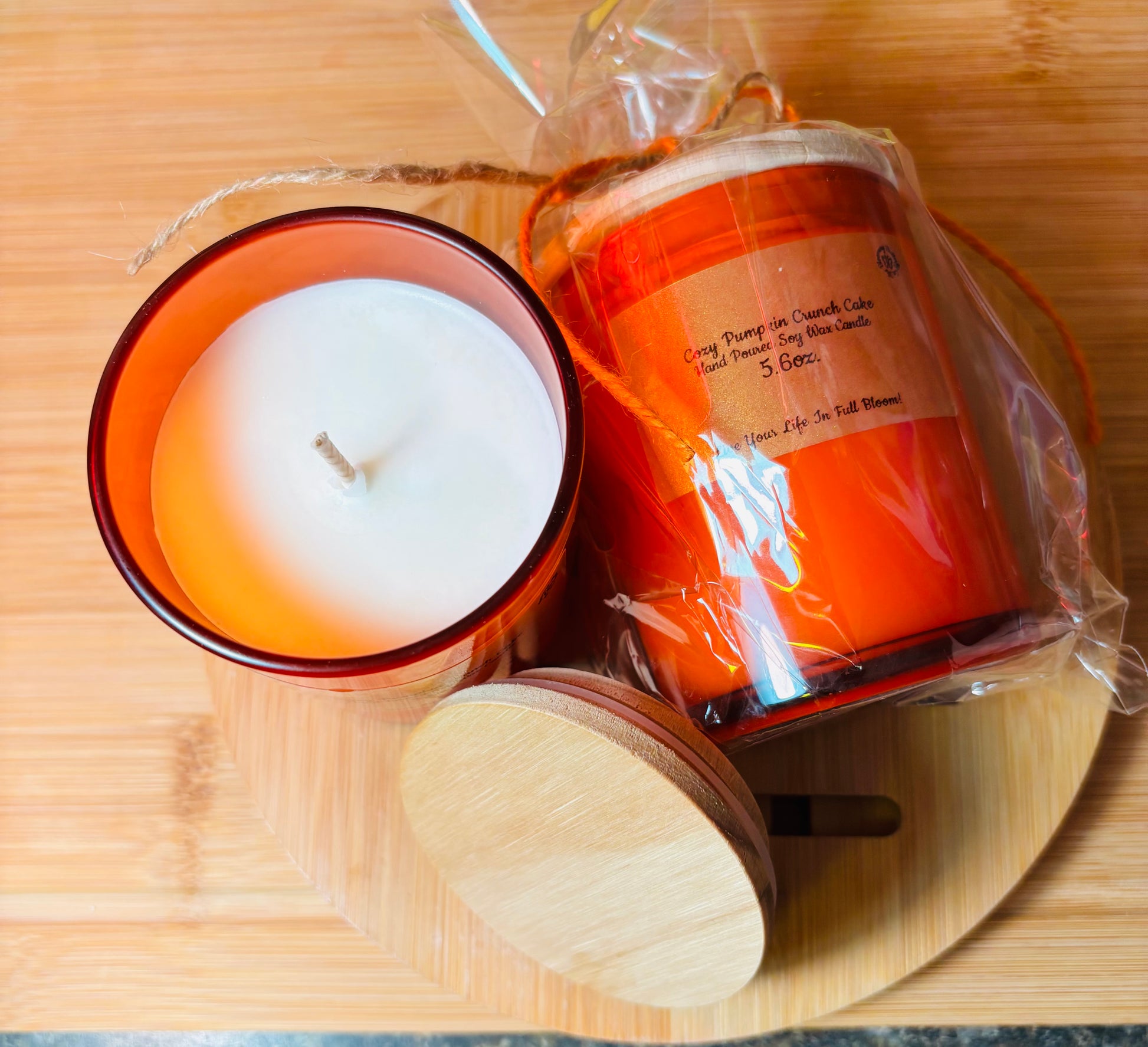 Pumpkin Crunch soy wax candle hand poured into these orange decorative glass jars with rustic wooden lid