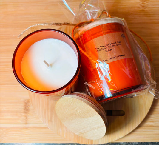 Pumpkin Crunch soy wax candle hand poured into these orange decorative glass jars with rustic wooden lid