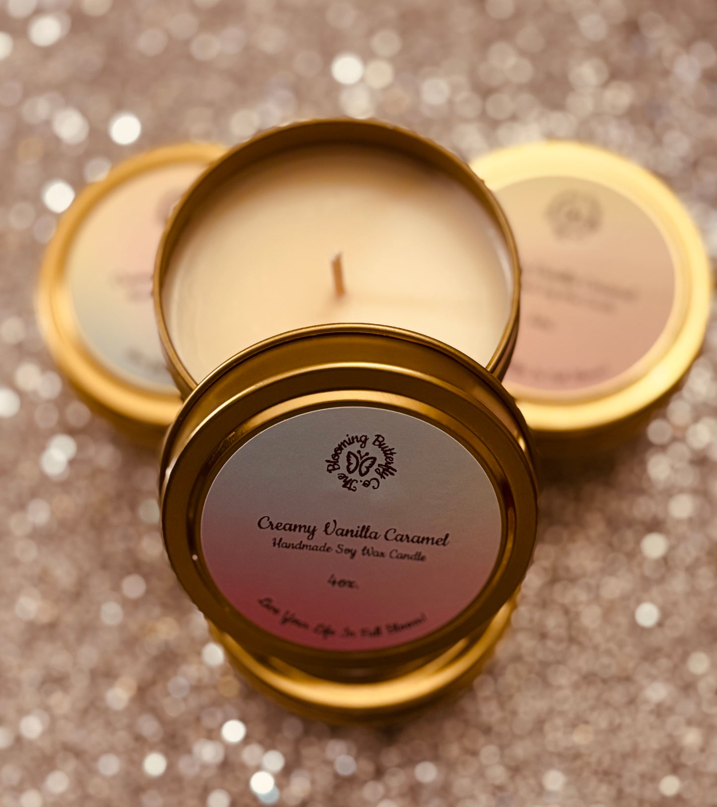 Creamy vanilla caramel soy wax candle in decorative gold 4oz. tin vessels.