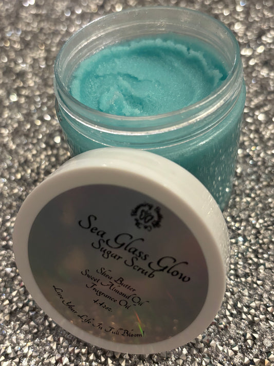 Creamy handcrafted shea butter sugar scrub with a touch of sea colored shimmer, and scented with a day at the spa fragrance