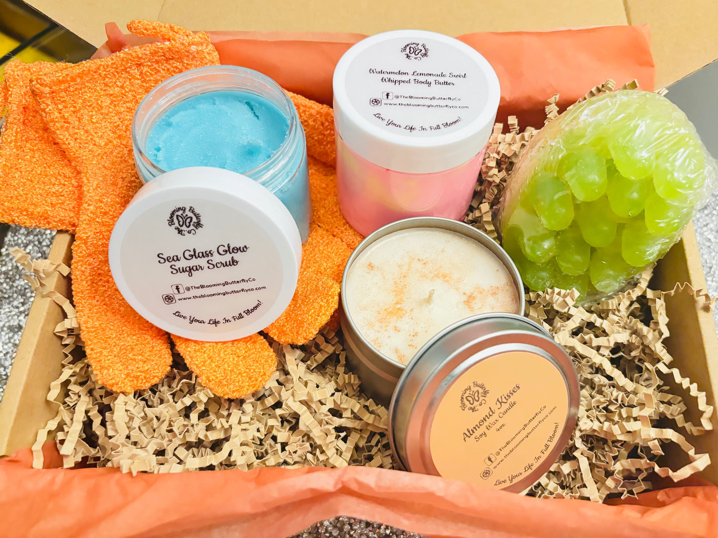 Creamy sugar scrub, whipped body butter, soy wax candle, bold fragrances, loofah soap bar in a bundle with exfoliating bath gloves