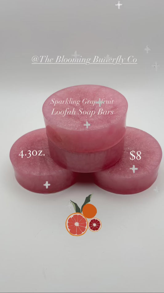 a video with music of a stack of pink sparkling grapefruit loofah soap bars by the blooming butterfly company